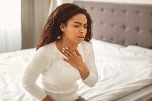 young-black-woman-coughing-suffering-from-sore-throat